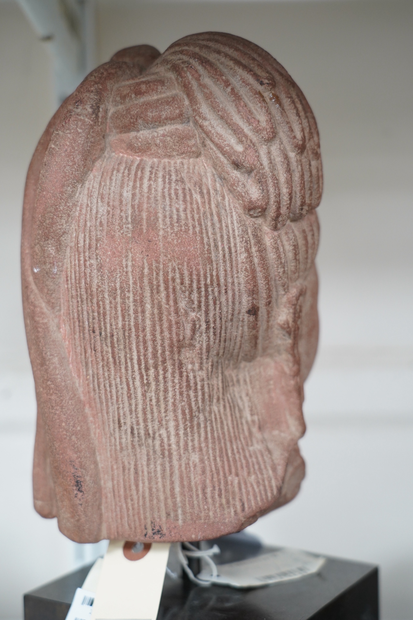 A red stone head of Ardhanarishvara, Muthura region, India, Gupta period, c.5th century A.D.